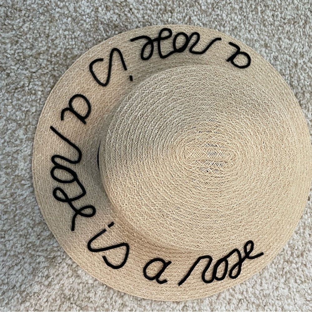 Eugenia Kim embroidered straw hat with strap.